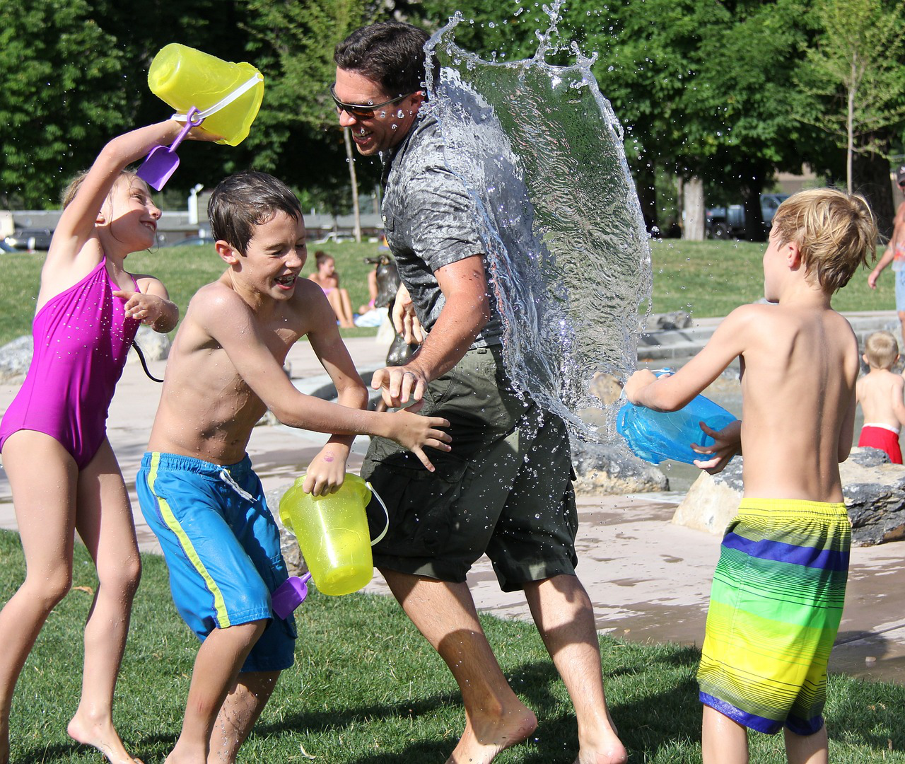 children playing and water fighting