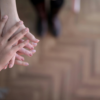 A group of people stacking their hands together